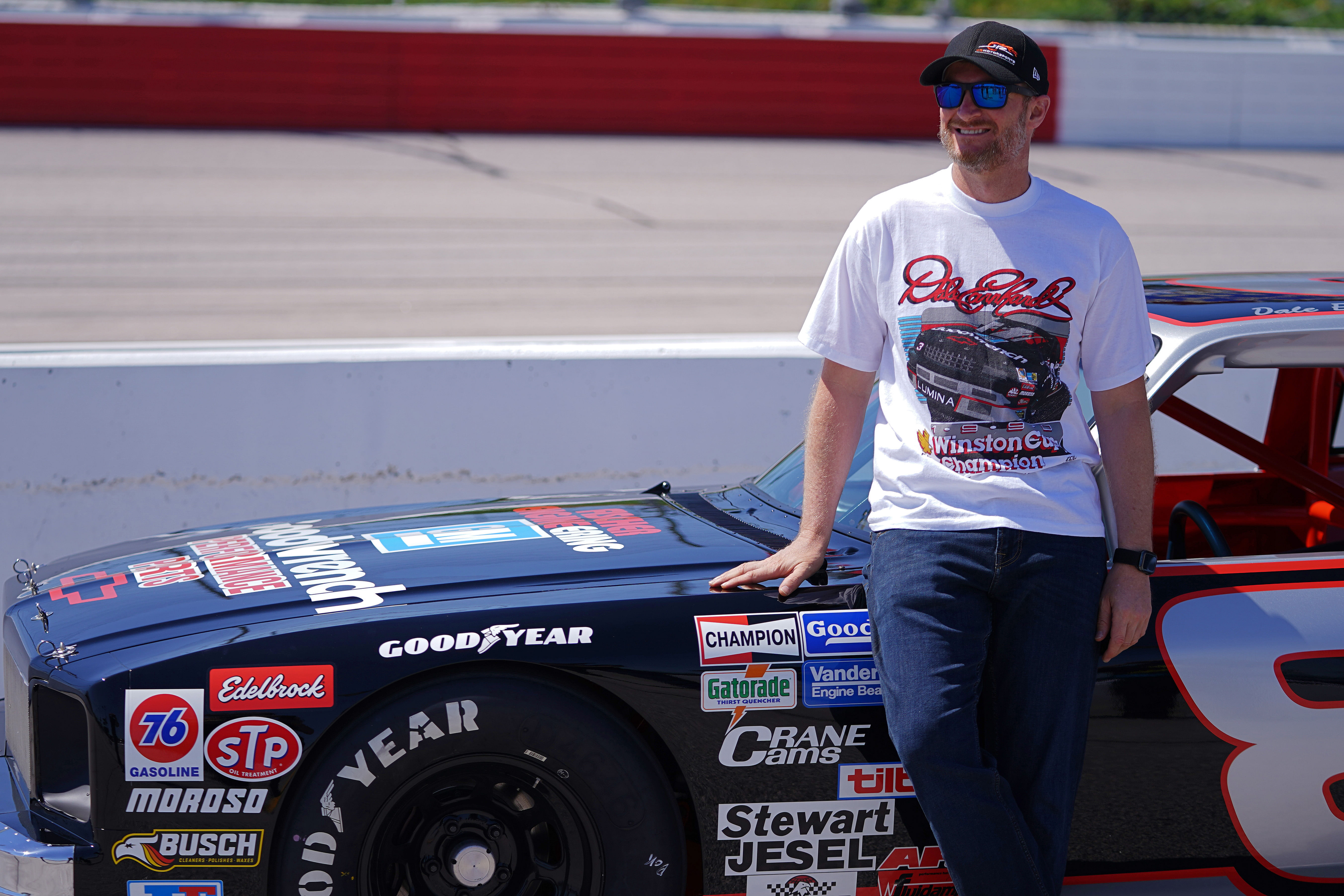 Dale Earnhardt Jr. poses with the restored 1984 Chevy Nova driven by the late Dale Earnhardt Sr. at Darlington. Source: Imagn